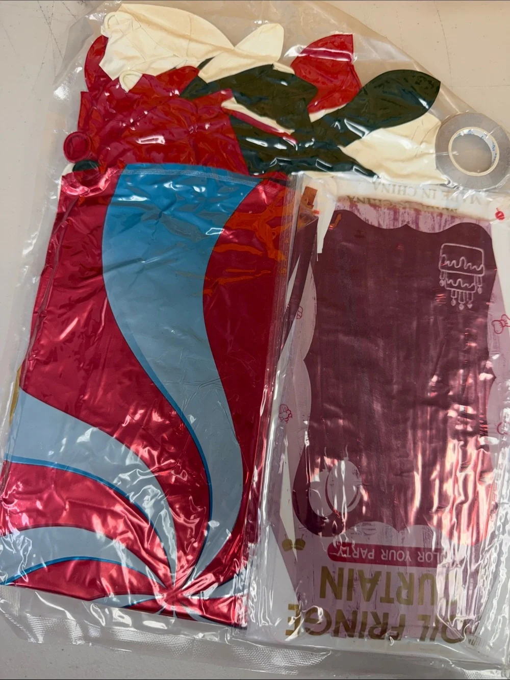Christmas Party Decorations in a bag foil fringe curtains mylar balloons and lat